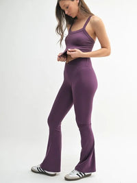Model wearing MONO B Seamless Solid Cami with matching purple pants, showcasing a seamless design and comfortable fit.