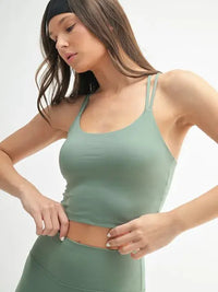 MONO B Venice Cloud Light Crisscross Sports Bra shown in a model wearing a stylish green color.