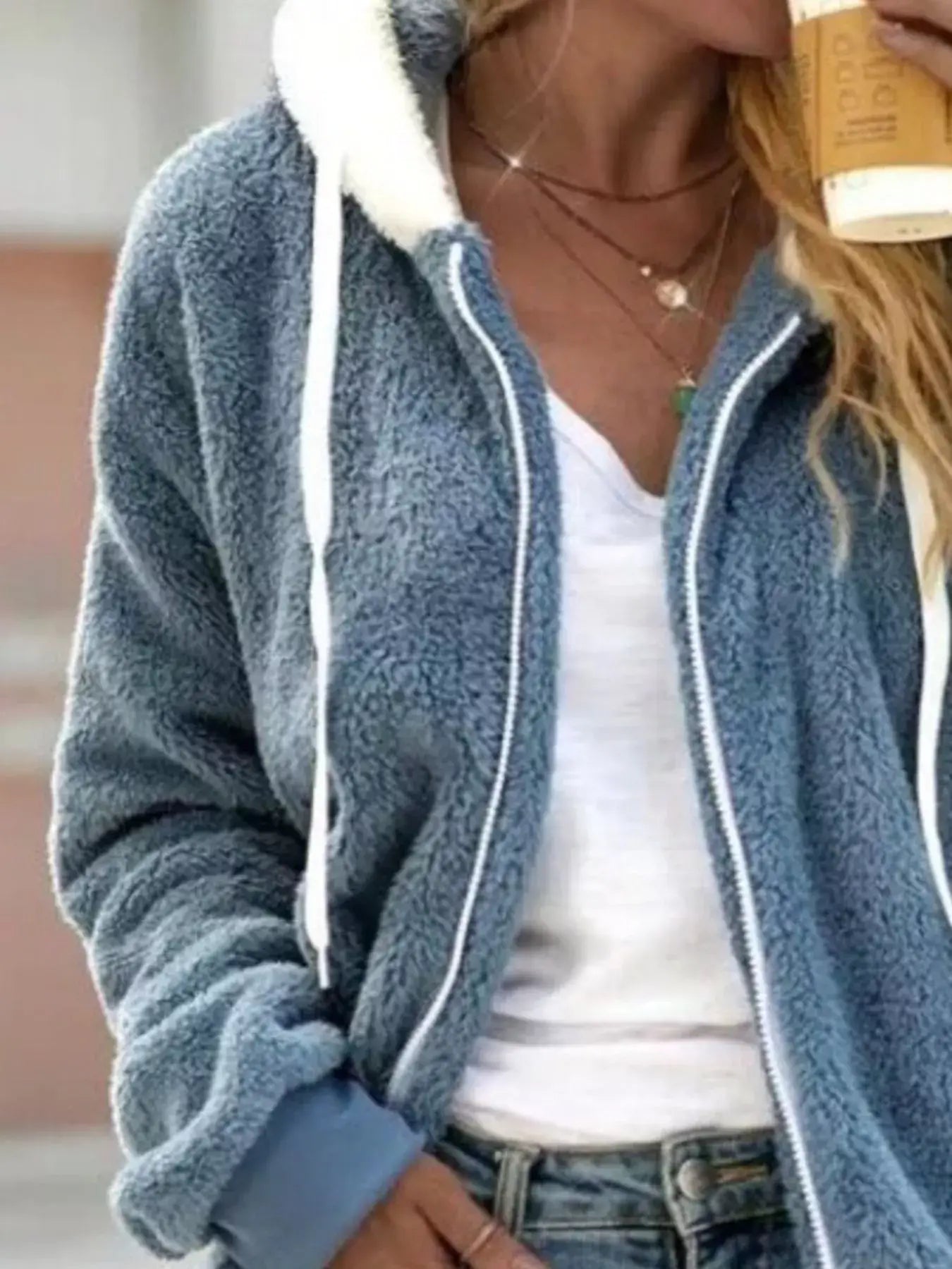 Full Size Cozy Fleece Zip-Up Hooded Jacket Plus Size worn by a woman sipping a coffee.