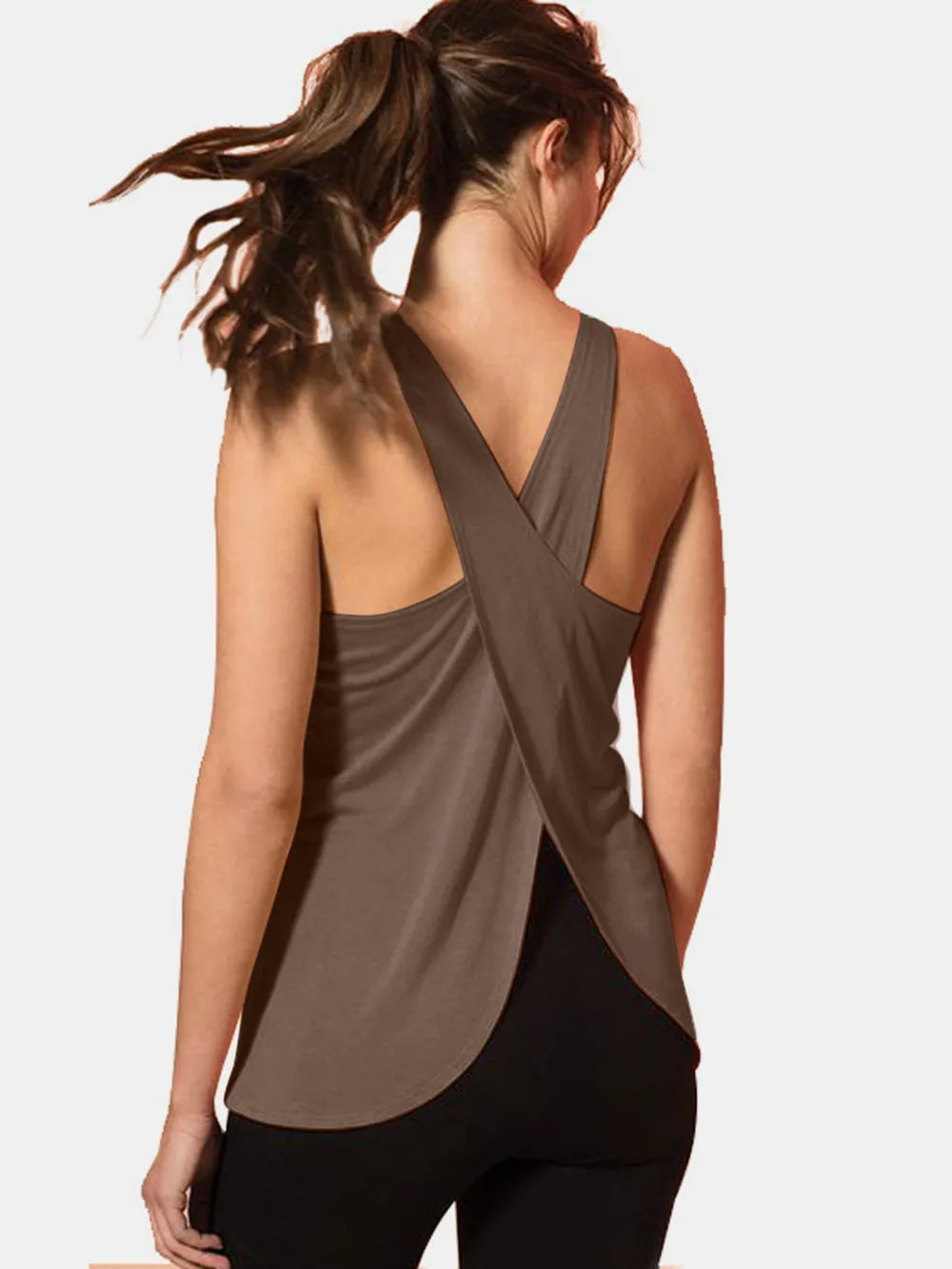 Back view of a model wearing a Crisscross Scoop Neck Active Tank in brown, showcasing its unique crisscross design.