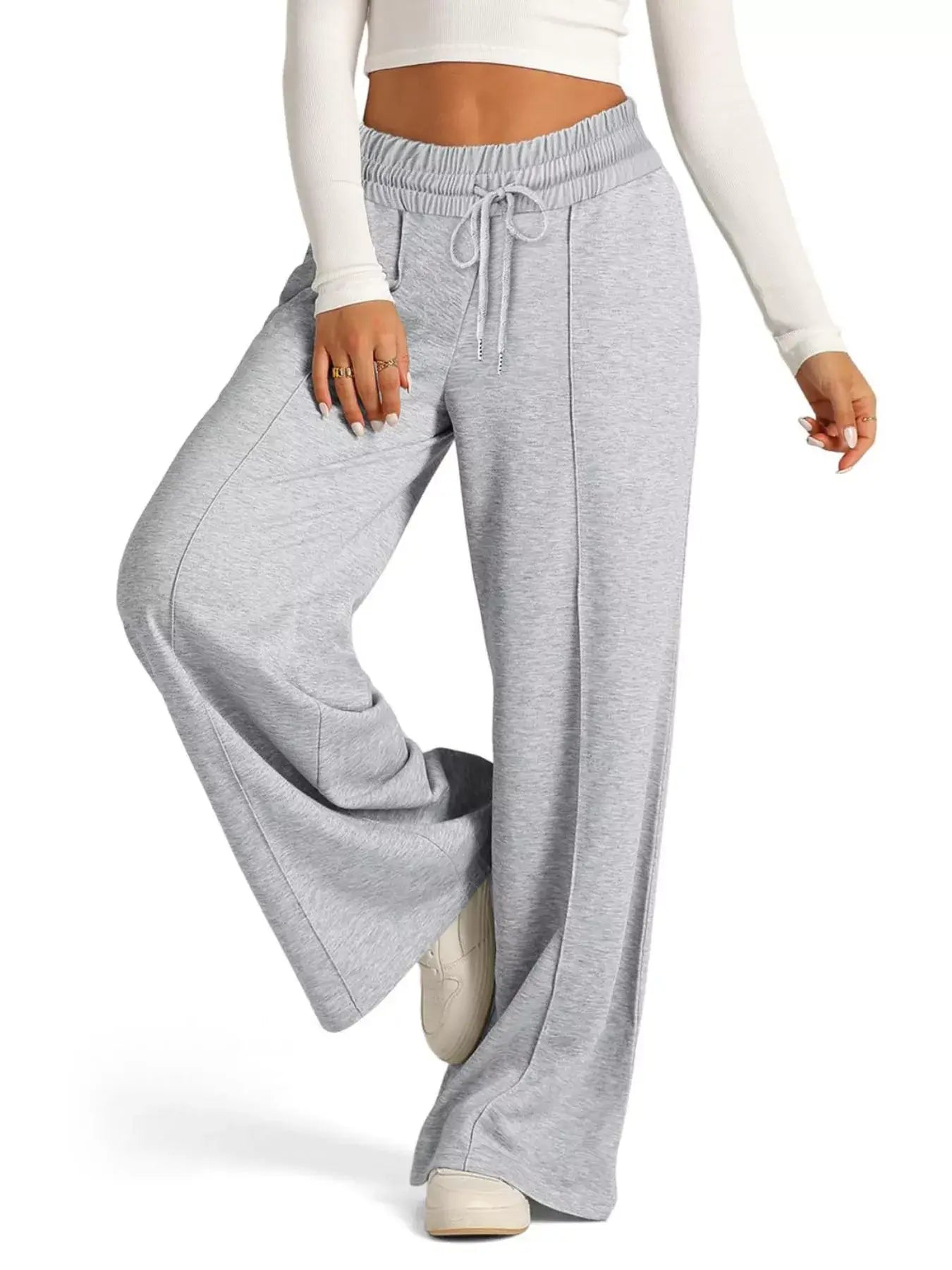 Woman wearing Drawstring Wide Leg Pants in gray with pockets, showcasing comfort and style.
