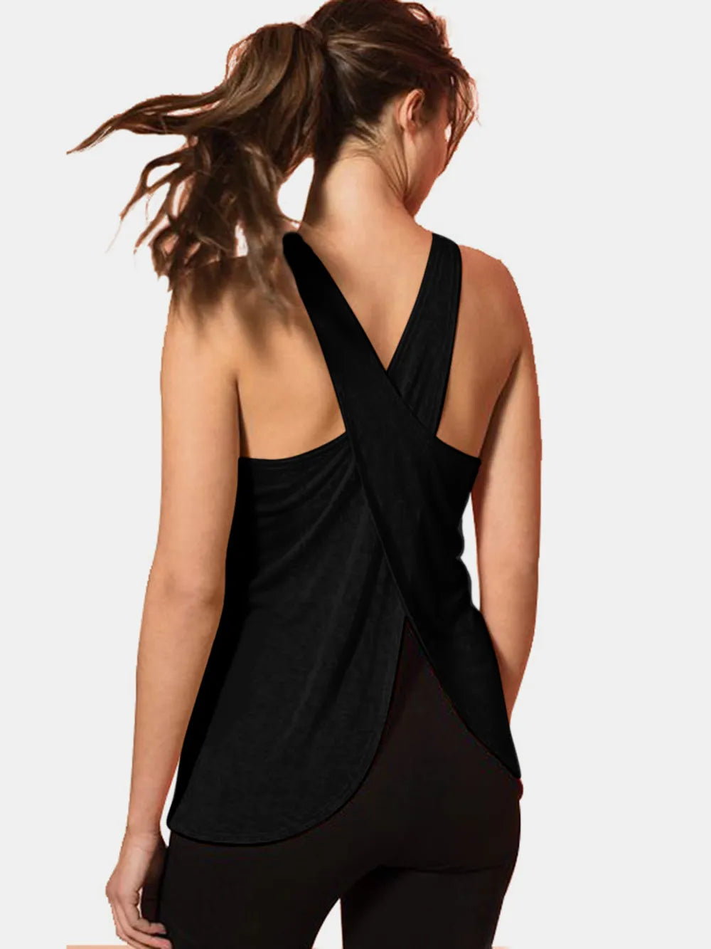 Back view of a woman wearing a Crisscross Scoop Neck Active Tank in black, showcasing the unique crisscross design.